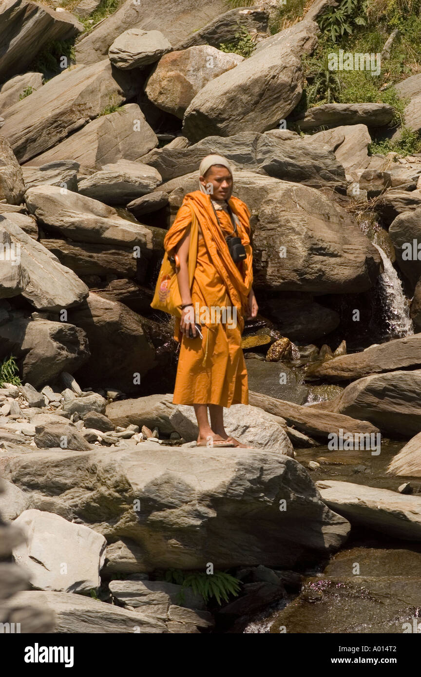 Theravada yellow robe Thai monka walking in mountains Stock Photo - Alamy