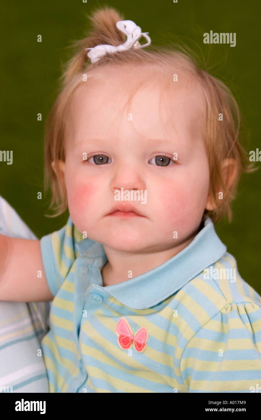 Portrait of 14 Month Old Baby Girl Being Held by Female in Park La Jolla California Stock Photo