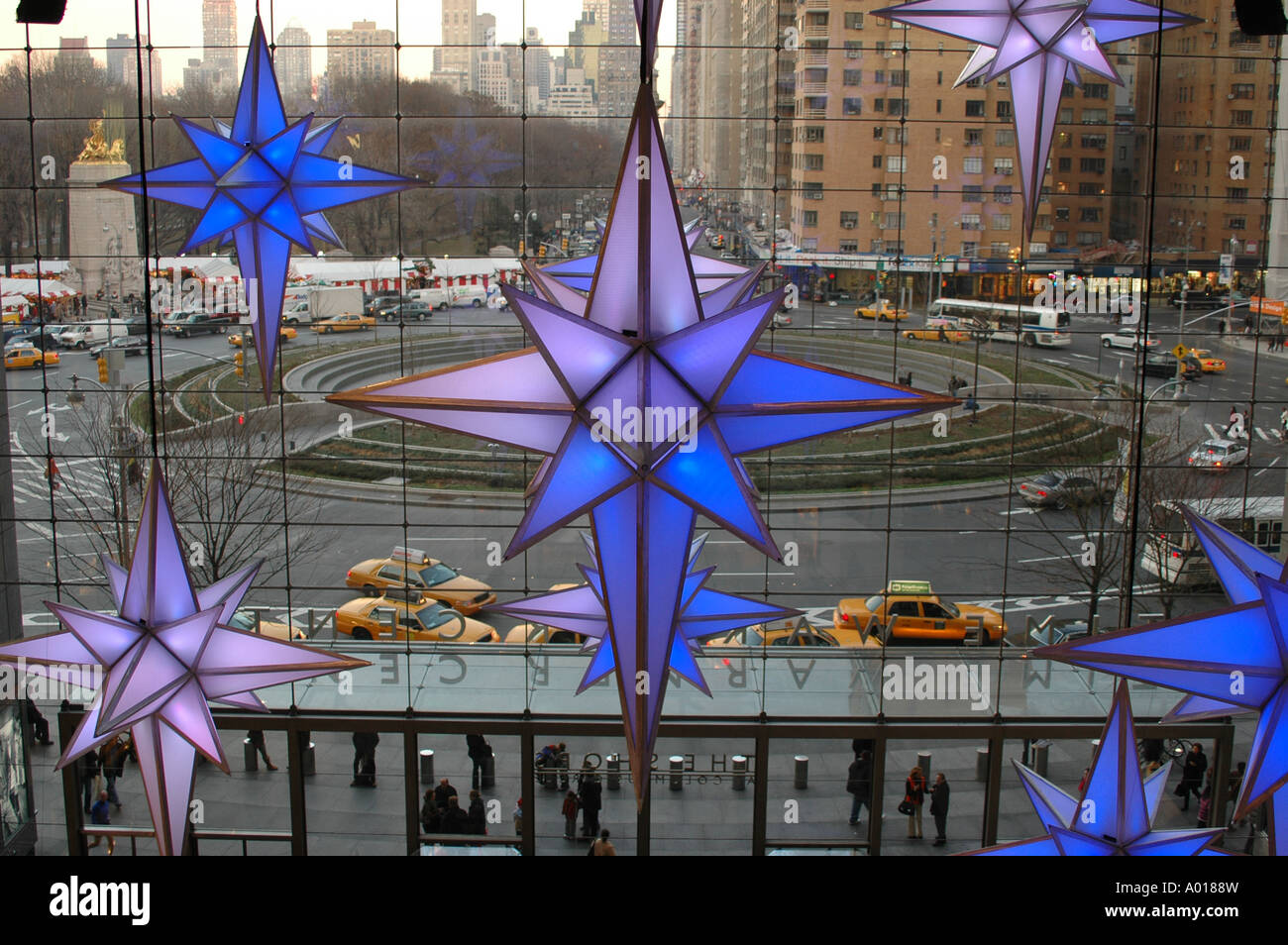NYC Star decoration for Christmas in Time Warner Center overlooking Columbus Circle with some New York City Yellow Cab Stock Photo