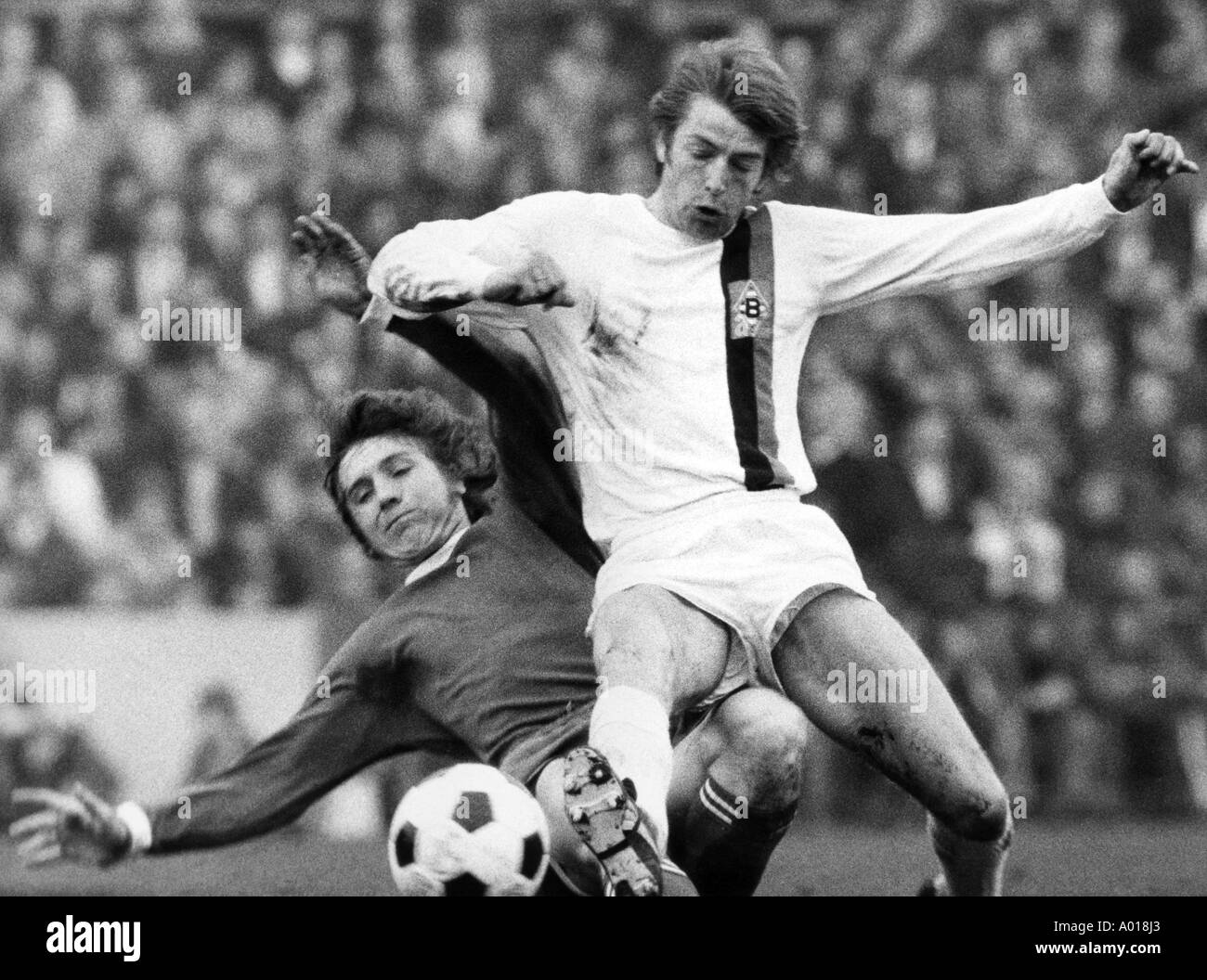 football, DFB Cup, quarter finale, 1971/1972, Borussia Moenchengladbach versus FC Schalke 04 2:2, Boekelberg Stadium, scene of the match, duel, tackle, Klaus Fischer, Hartwig Bleidick, b&w, black and white, black & white photography Stock Photo