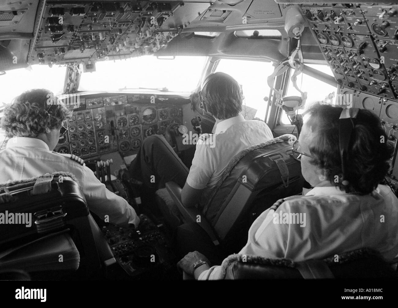 aeroplane, airplane, aircraft, cockpit, crew, flight attendant, pilot, pilots, radio operator, technology, engineer, dashboard, instruments, controls, transport, traffic, travel, flight, journey by air, b&w, black and white, black & white photography Stock Photo