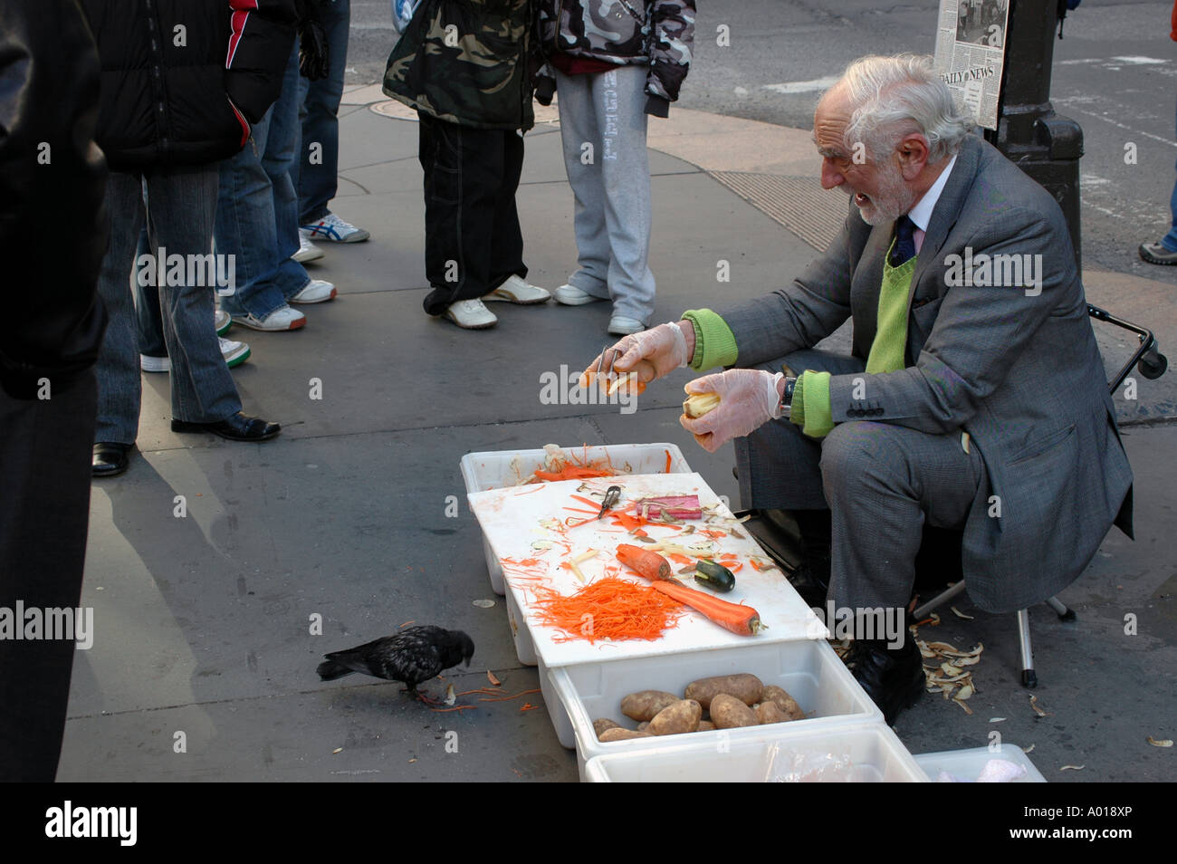 NYC Joe Ades selling food peeler on the sidewalk near 5th Avenue in  Manhattan with a pigeon infront of him Stock Photo - Alamy
