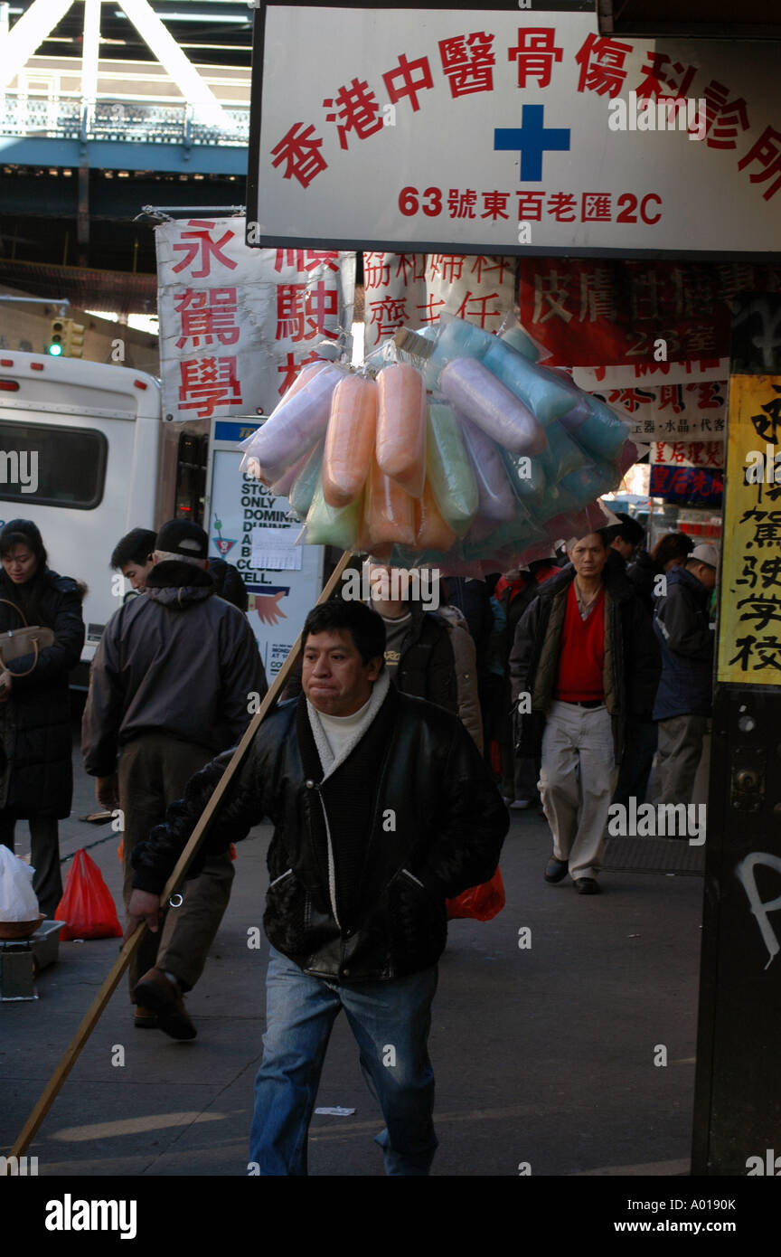 NYC Street food vendor Mexican man selling cotton candy in East Boardway Chinatown Manhattan