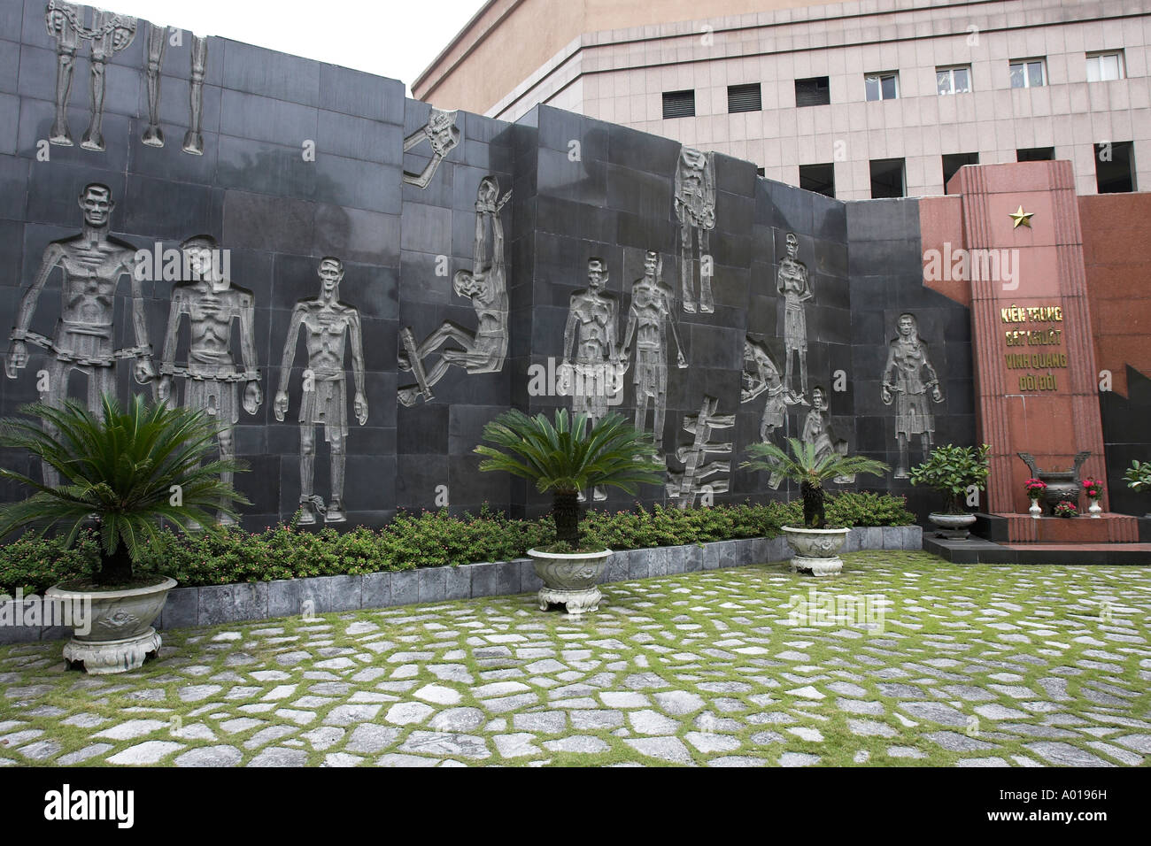 Memorial wall showing prisoner treatment infamous French and Vietnamese Hoa Lo prison also called the Hanoi Hilton Vietnam Stock Photo