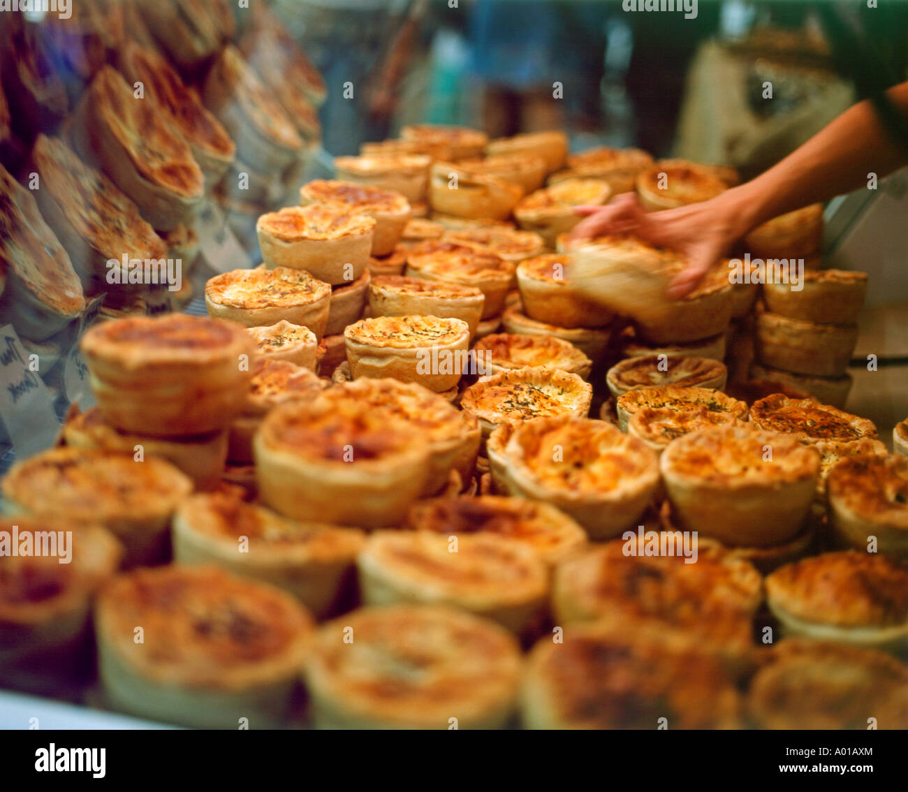 Homemade vegetarian cheese pies in display case in Spitalfields Market London England UK KATHY