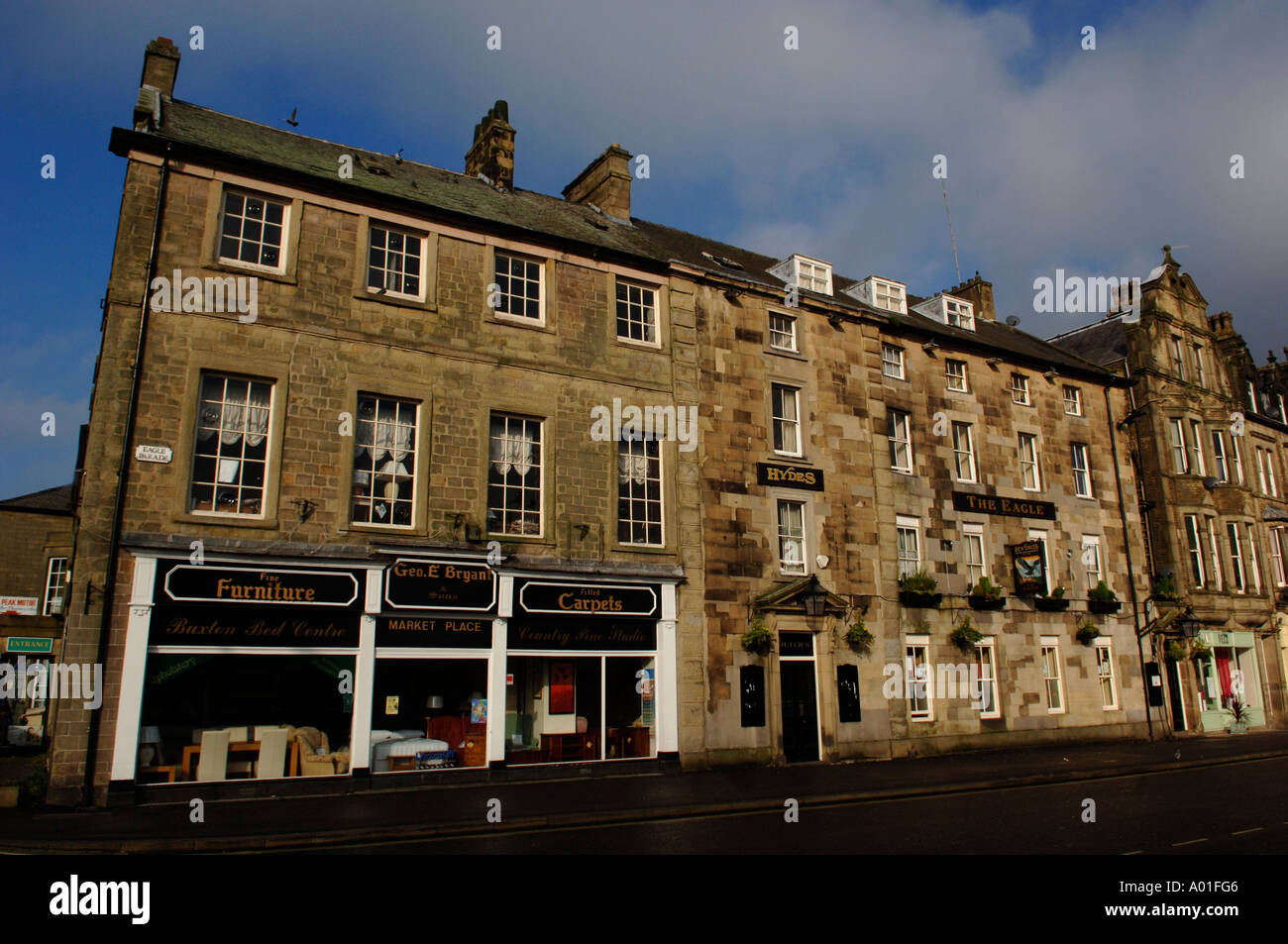 Street of houses and shops in Buxton, Derbyshire, England, UK Stock