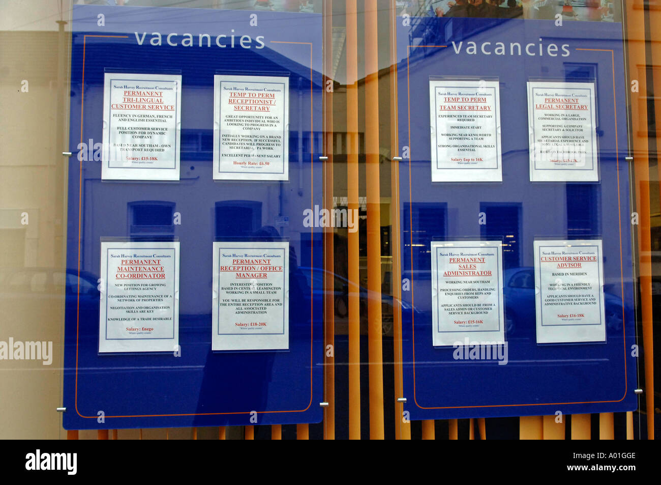 Job adverts placed in the window of a recruitment agency, England, UK Stock Photo