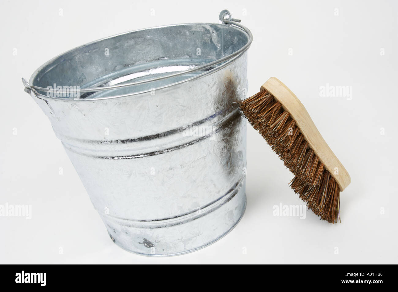 Galvanised steel bucket scrubbing brush working class concepts Stock