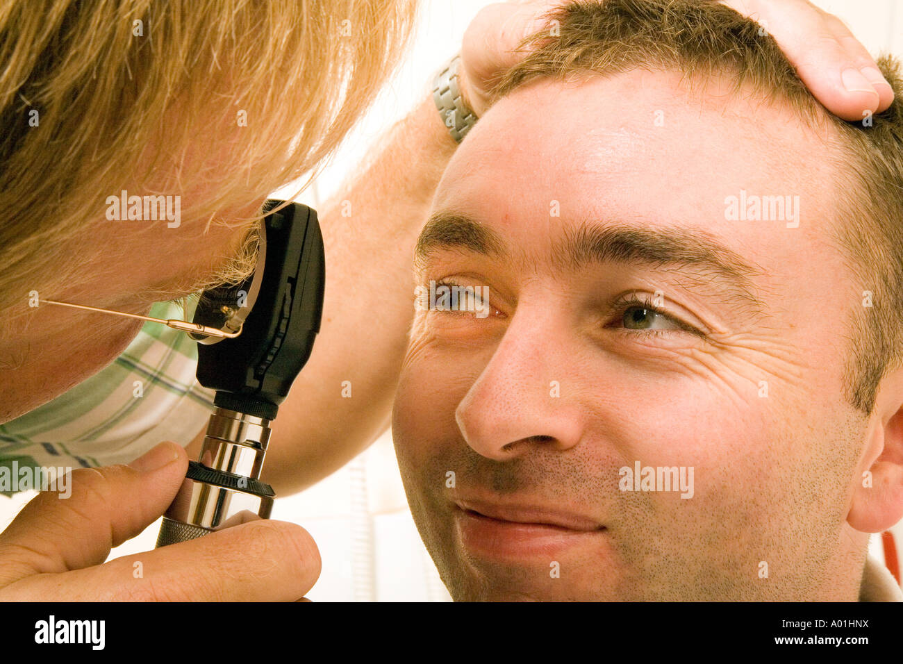 Eye inspection using an ophthalmoscope Stock Photo Alamy