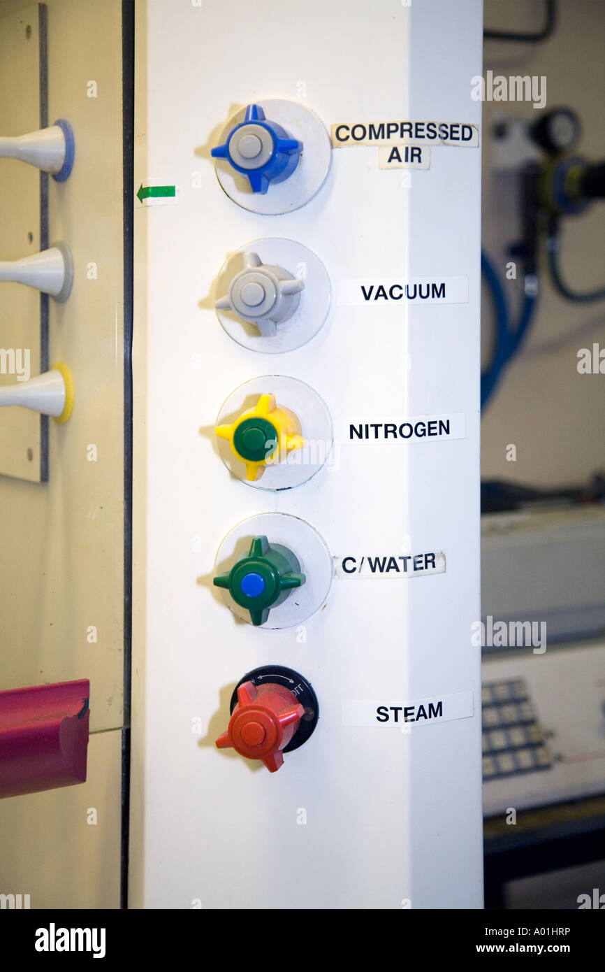 Gas supply taps valves for laboratory fume cupboard Stock Photo