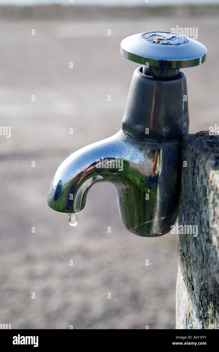 Chrome stand pipe public tap dripping water Stock Photo Alamy