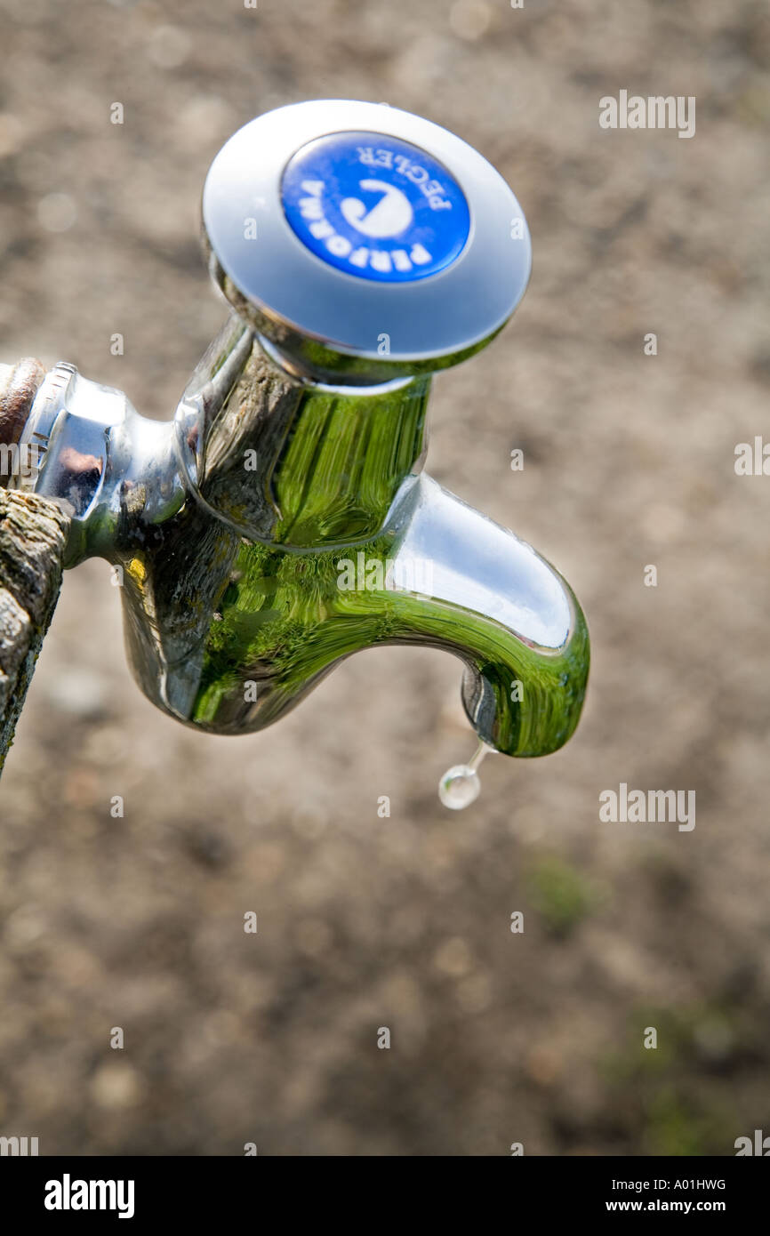 Chrome stand pipe public tap dripping water Stock Photo Alamy