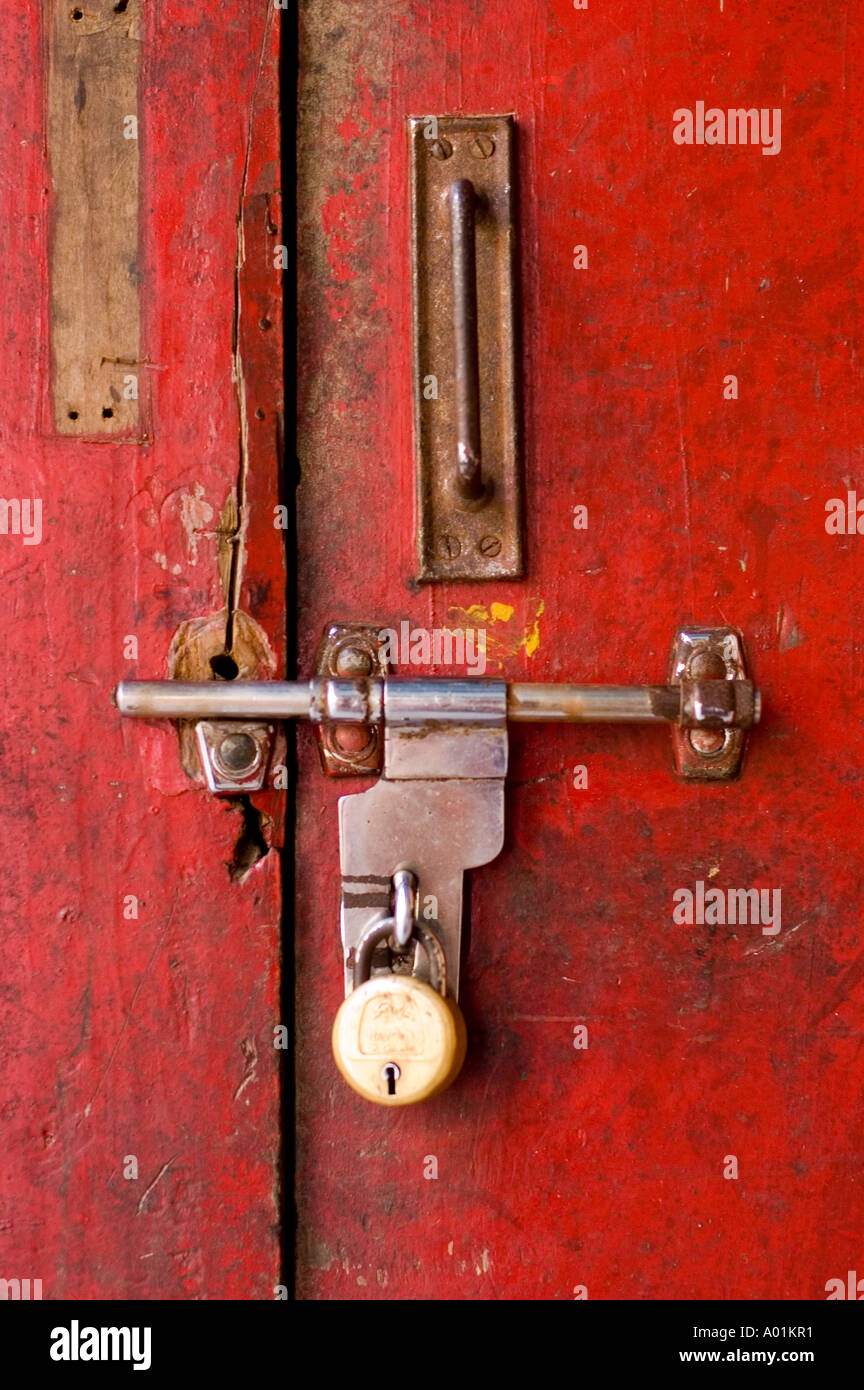 Close up of traditional old indian door lock with red background Stock ...