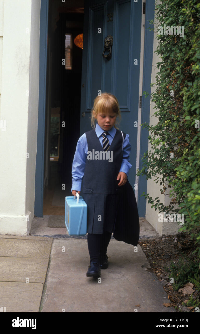 child walking out of the house on her first day at school Stock Photo ...