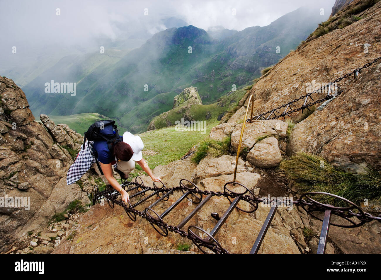 Hiker on ladder in the Drakensberg South Africa Stock Photo