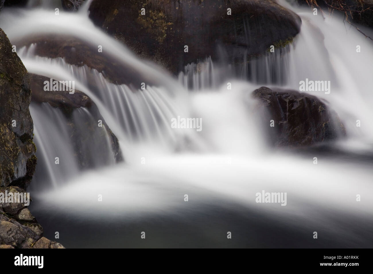 White water fast flowing over rocks in Mosedale Beck in Lake District National Park, Cumbria, England, UK, britain Stock Photo