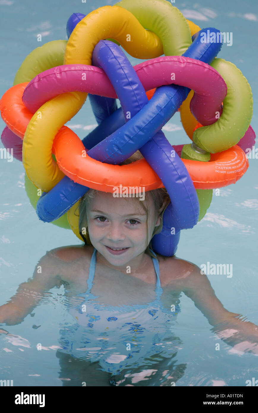 Child wearing a funny hat in a pool Stock Photo Alamy