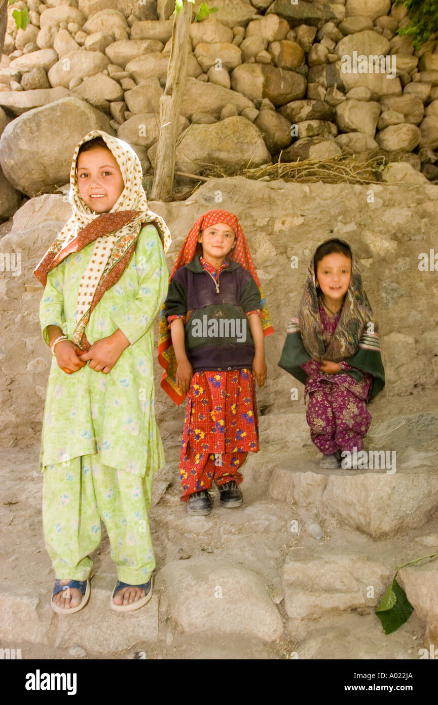 A group of young Muslim Dard or Brokpa girl in color clothes looking at camera and smilin Sunjak village Ladakh Kashmir India Stock Photo