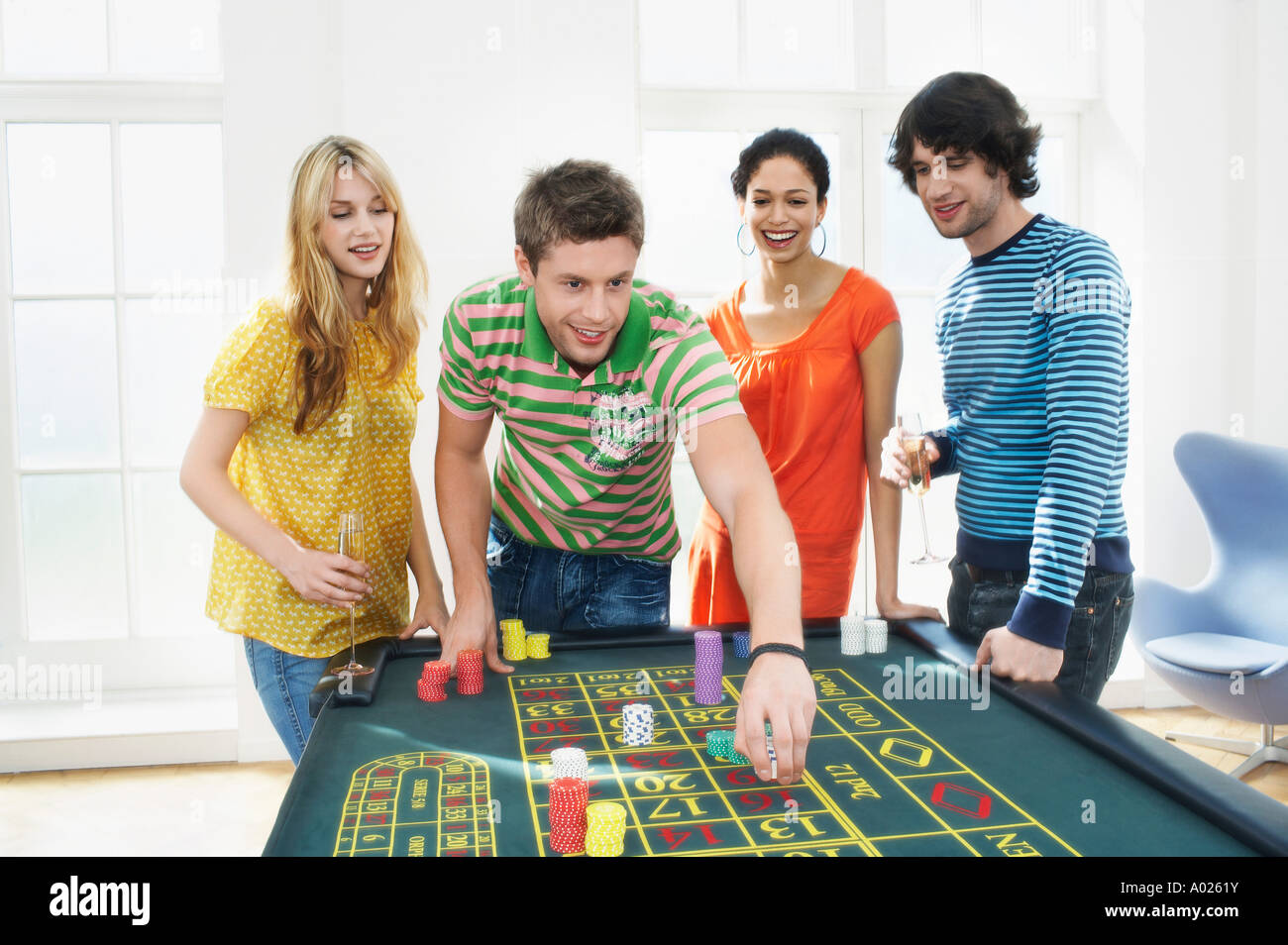 Friends Gambling on roulette table Stock Photo