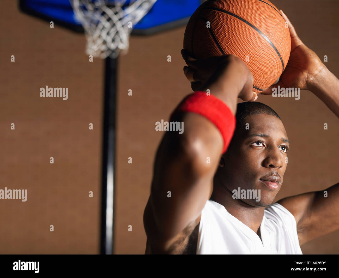 Basketball player preparing to throw ball, portrait Stock Photo Alamy