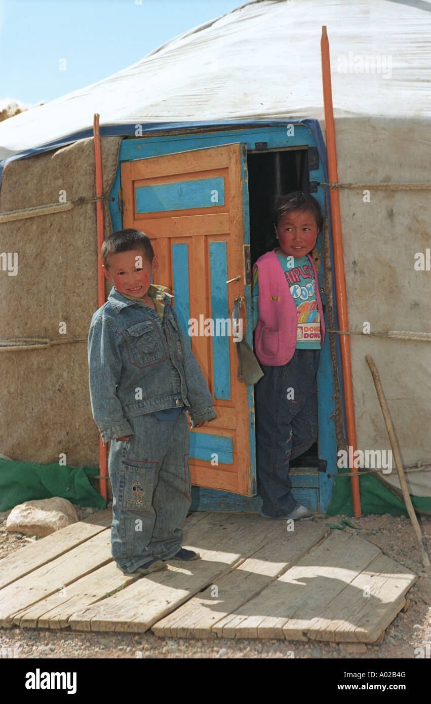 Children near entrance to traditional Mongolian dwelling yurt or ger. Ontsyn Khudo, Shurgiin Gol river, Khovd aimag (province). Stock Photo