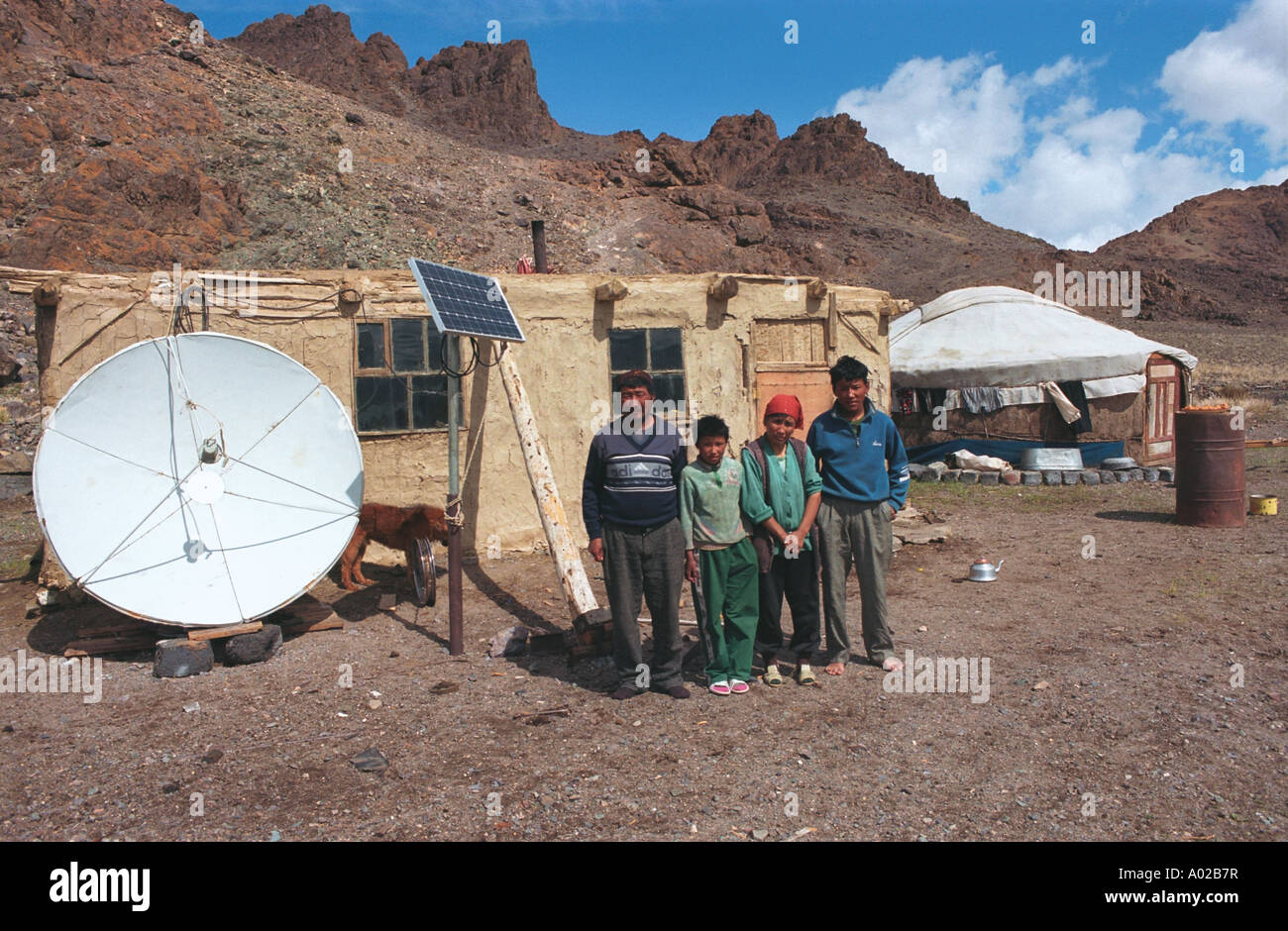 Portrait of Rakhmed’s family near national dwelling ger or yurt. North-West side of Tolbo Nuur (Lake). Bayan-Ulgi aimag province Stock Photo