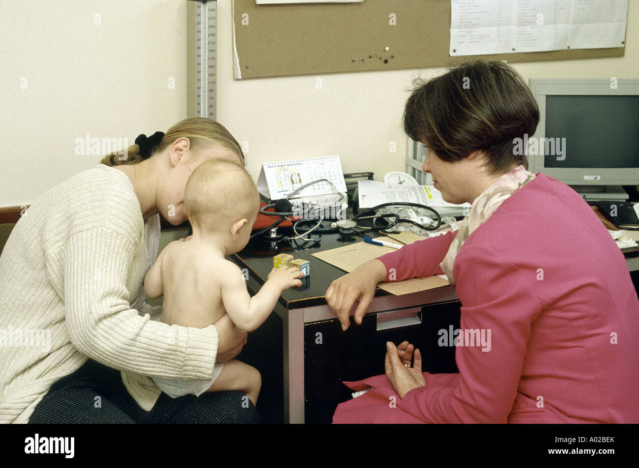 health visitor testing on young toddler in health clinic Stock Photo