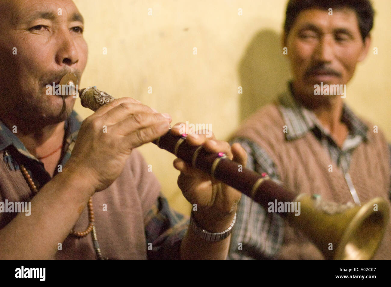 Ladakhi man playing traditional music instrument Surma trumpet Ladakh ...