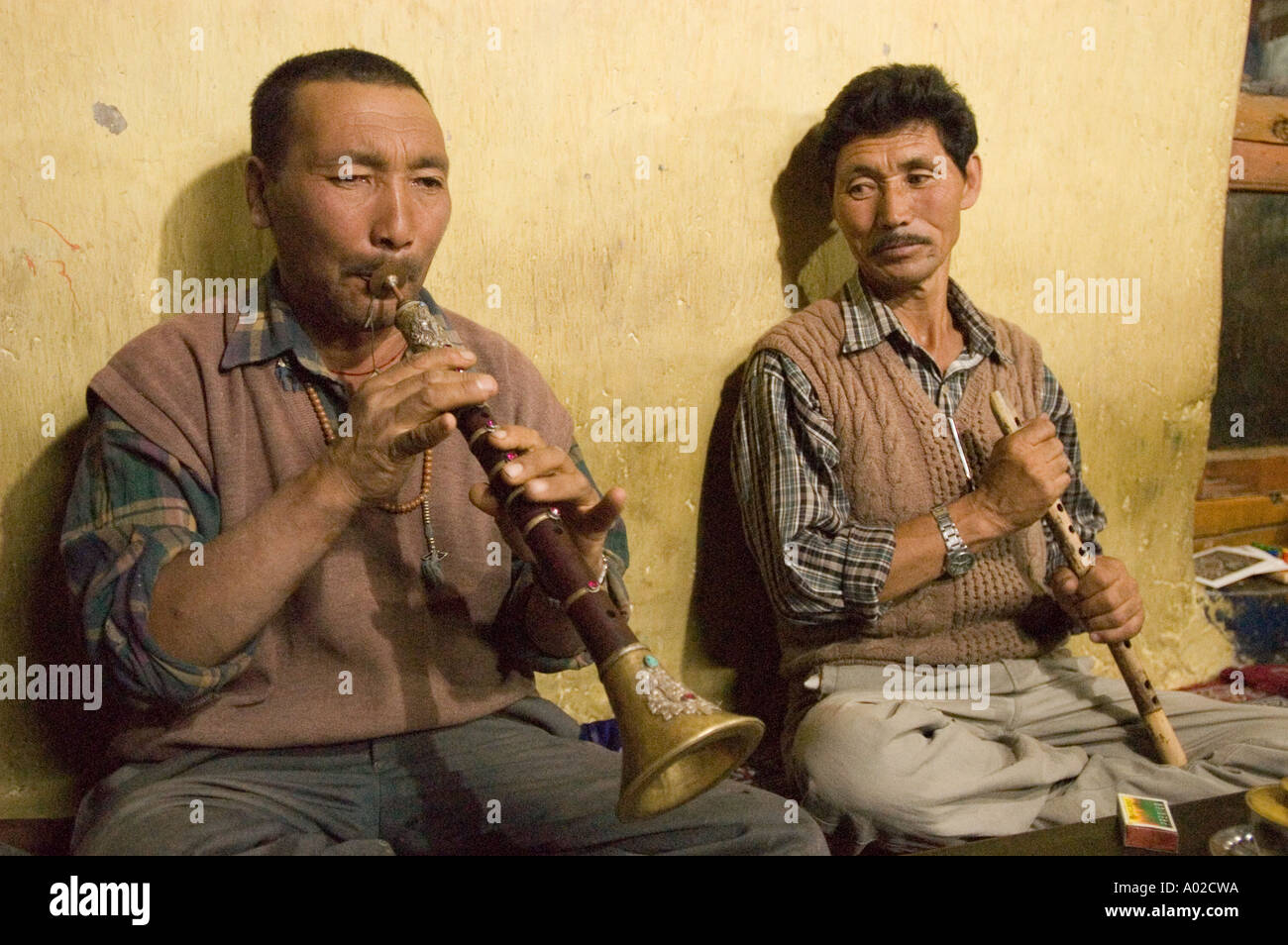 Ladakhi man playing traditional music instrument Surma trumpet Ladakh ...