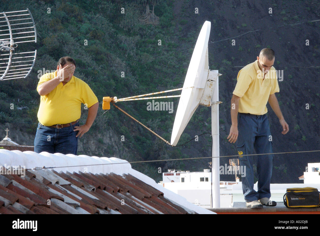 3571 Satellite repairmen Not model released Stock Photo