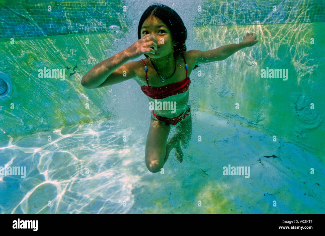 Young girls swimming underwater hi-res stock photography and images - Alamy