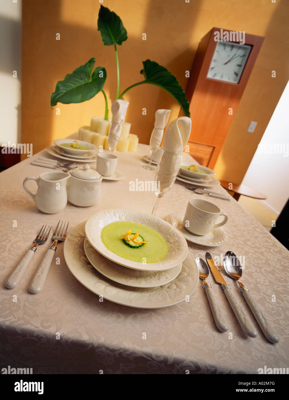 Table setting with asparagus soup Stock Photo