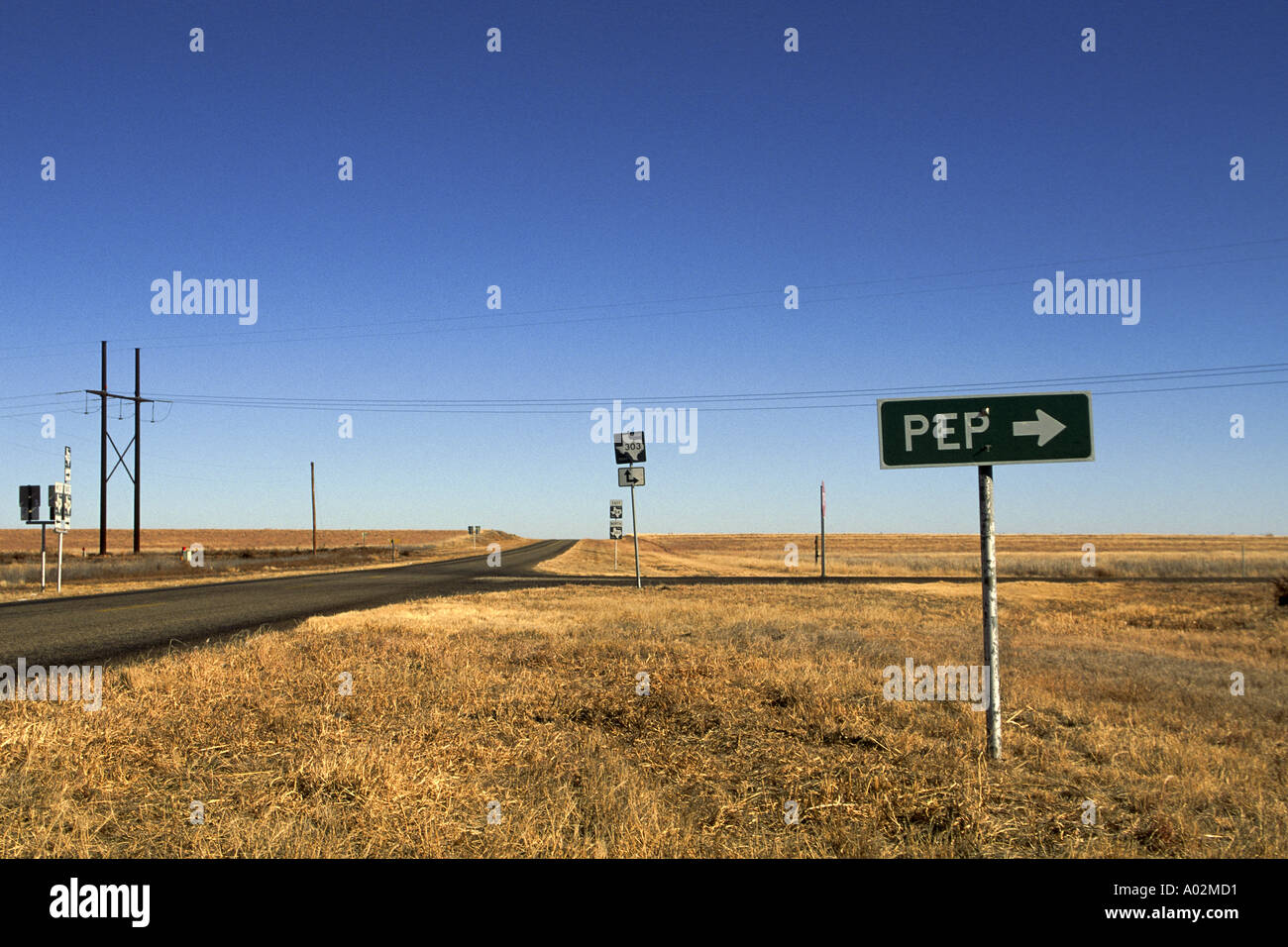 Crossroads intersection on farm to market road sign pointing to Pep Texas Stock Photo