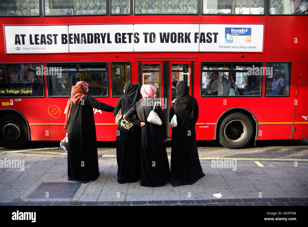 Four Muslim women wearing hijab shopping in Oxford Street, London Stock