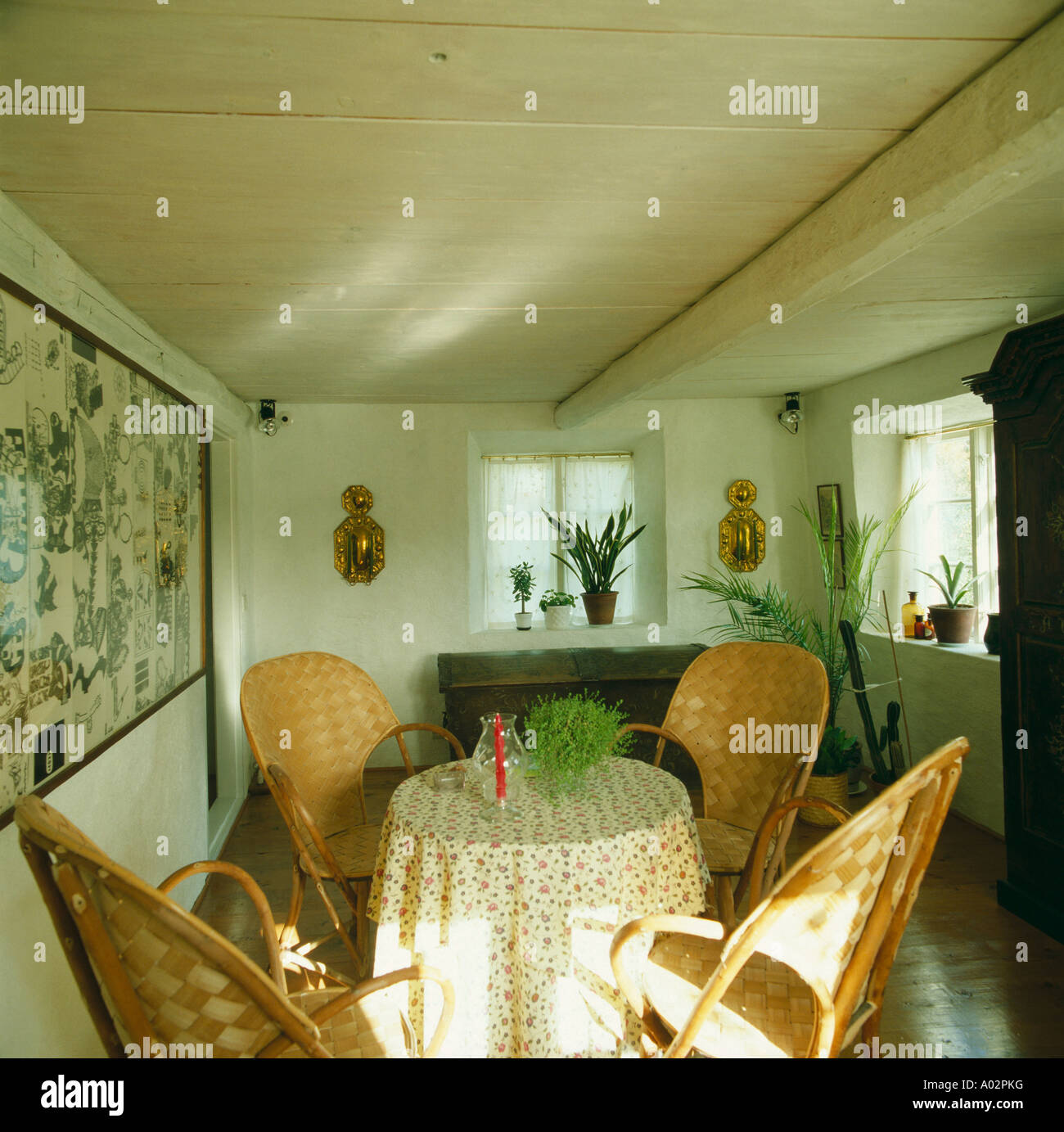 Small Swedish Cottage Diningroom With Willow Chairs Stock Photo