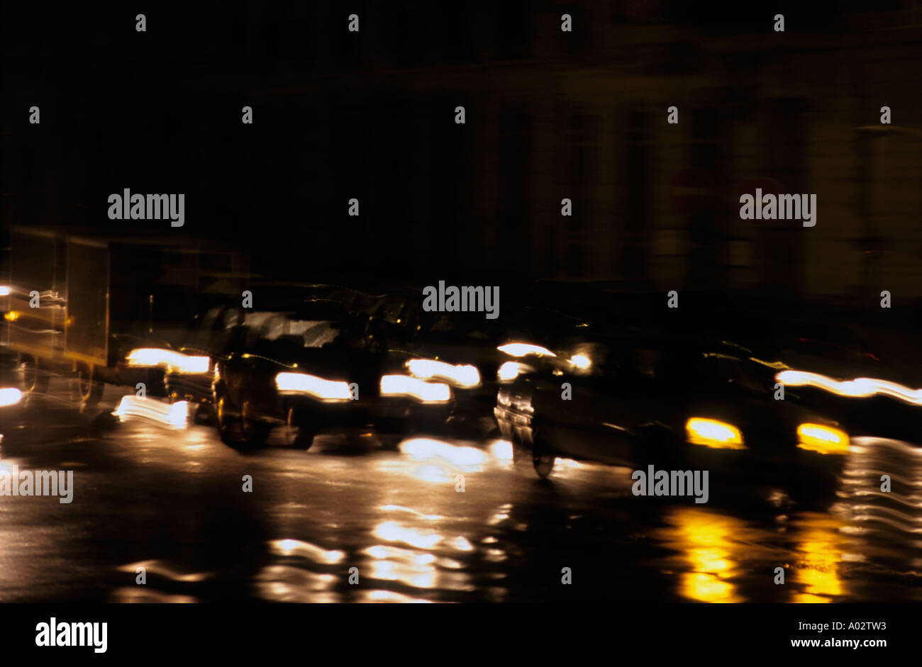 Blurred headlights car at night Stock Photo