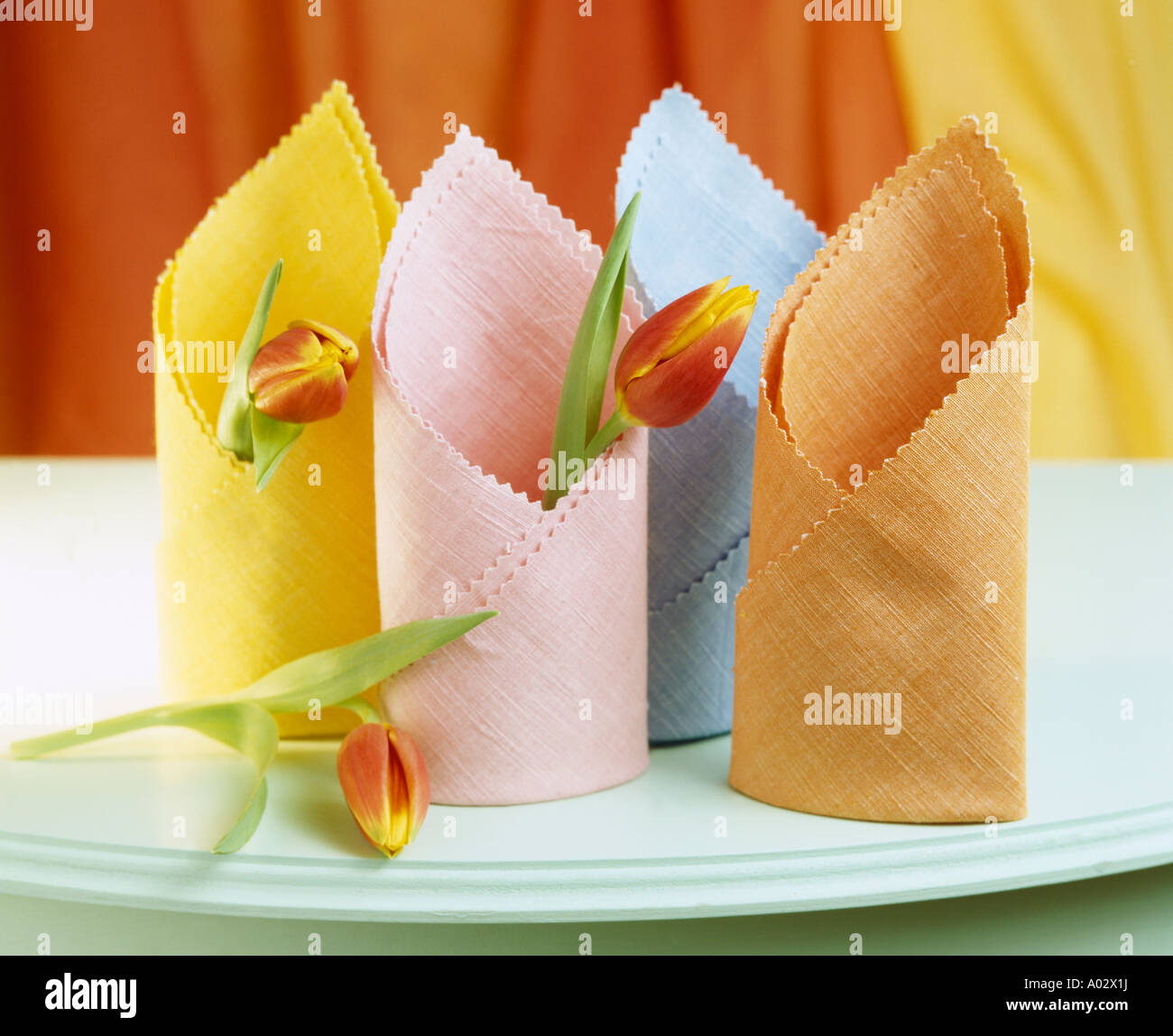 Close-up of orange pink and yellow table napkins Stock Photo