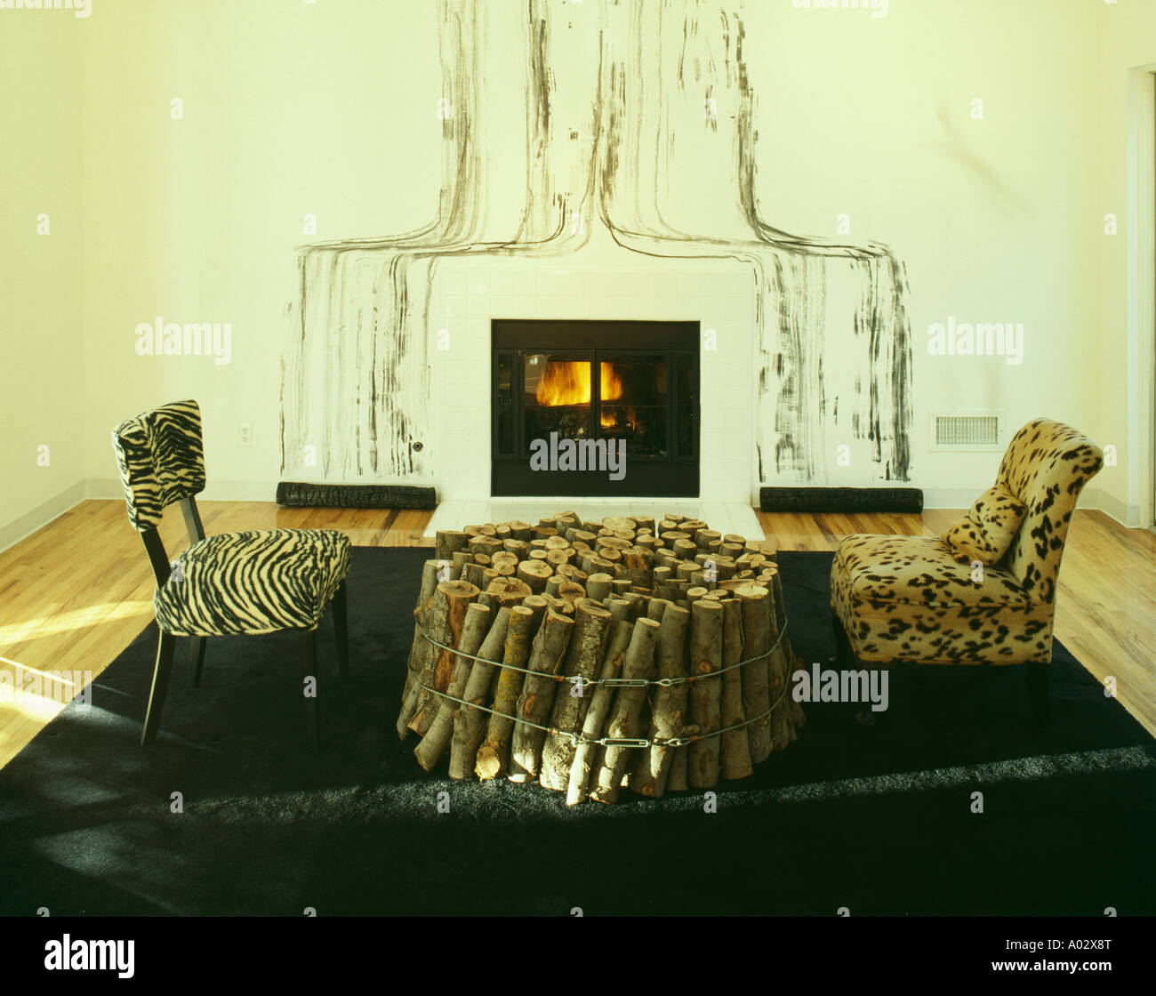 Animalprint Modern Chairs And Log Table In Front Of Fireplace With