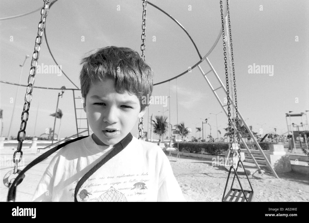 Portrait of young boy in a amusement park Stock Photo