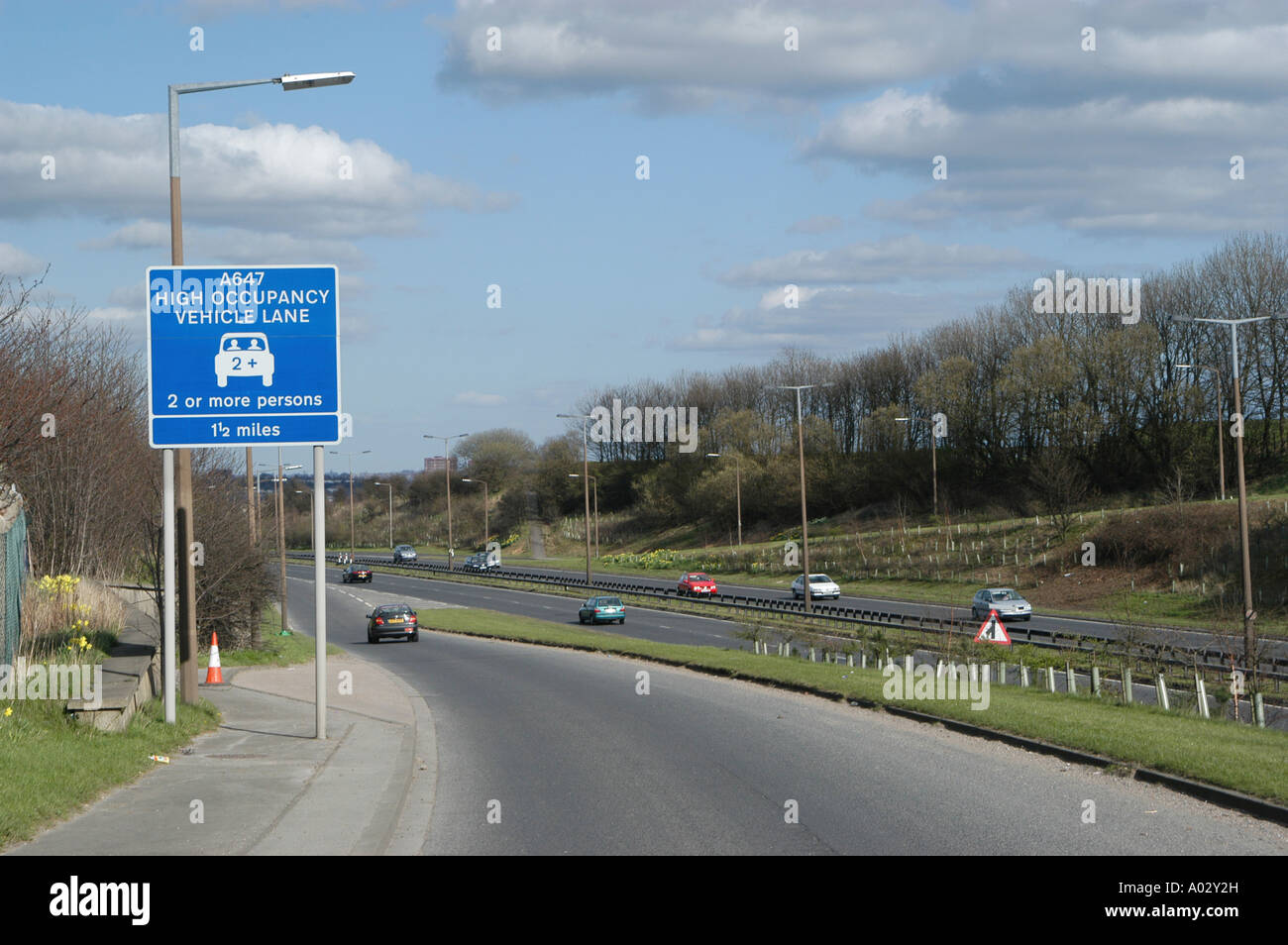 High occupancy vehicle lane sign to encourage car sharing among commuting drivers in the uk Stock Photo
