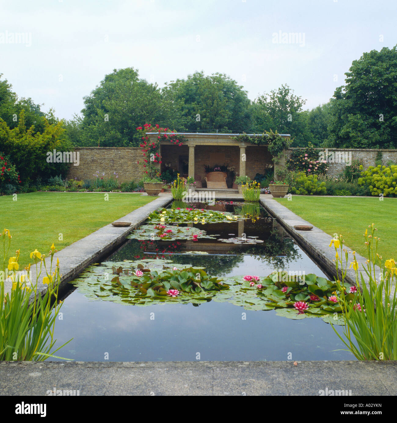 Pool in large English garden Stock Photo - Alamy