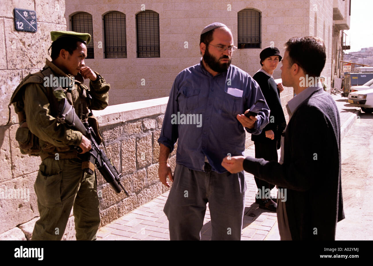 Two men having an argument in a settlement in Hebron Stock Photo