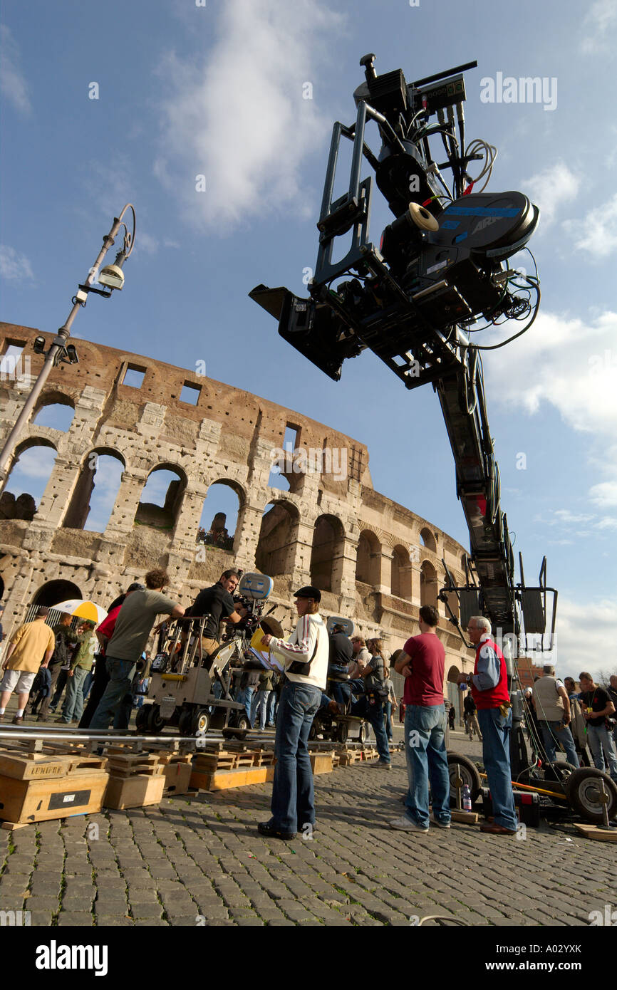 Rome Italy Feature film crew at work on location at the Colosseum using dolly tracks remote controlled telescopic crane Stock Photo