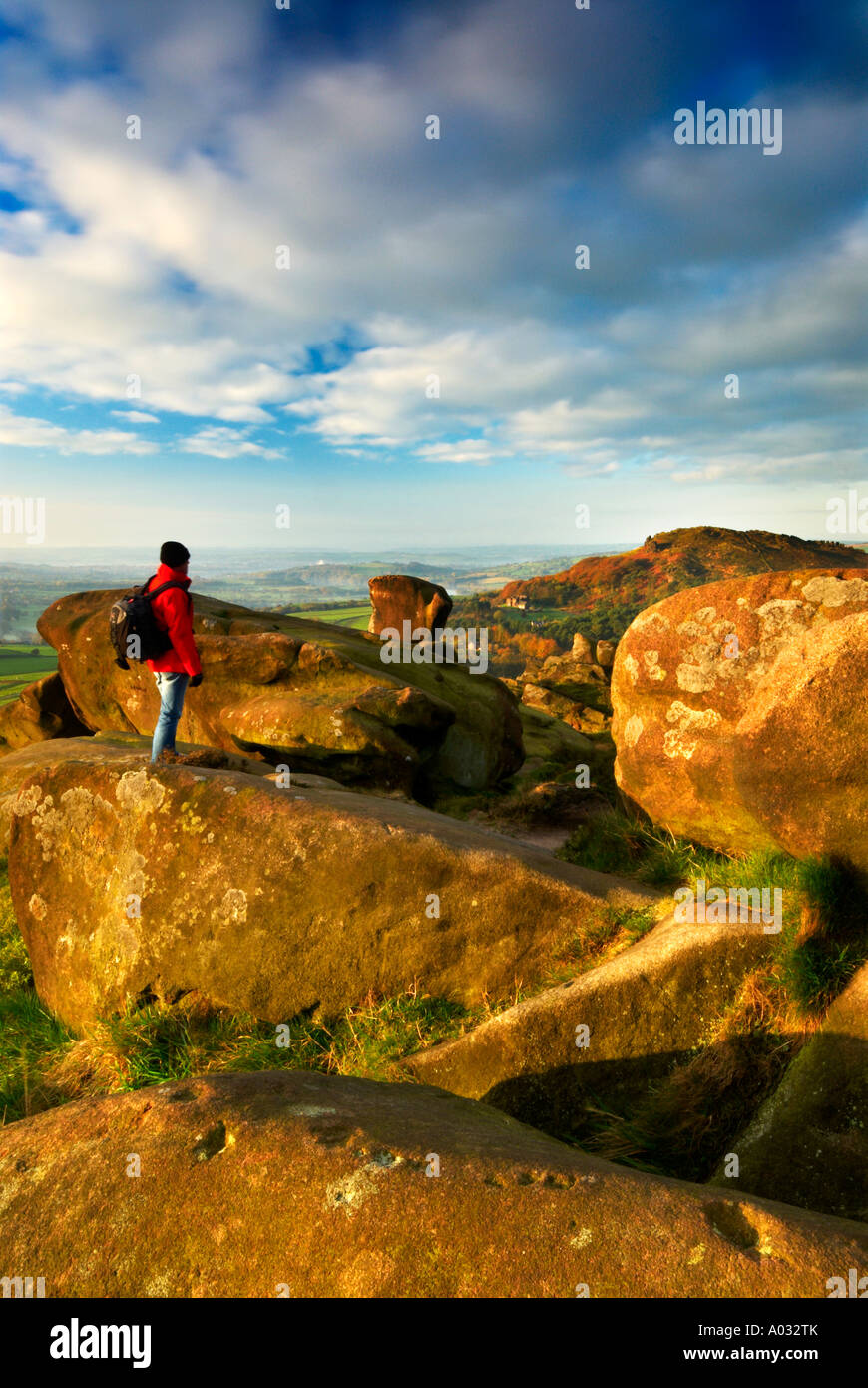 Walker Standing By Ramshaw Rock Looking Towards Hen Cloud At The Roaches Staffordshire UK Stock Photo