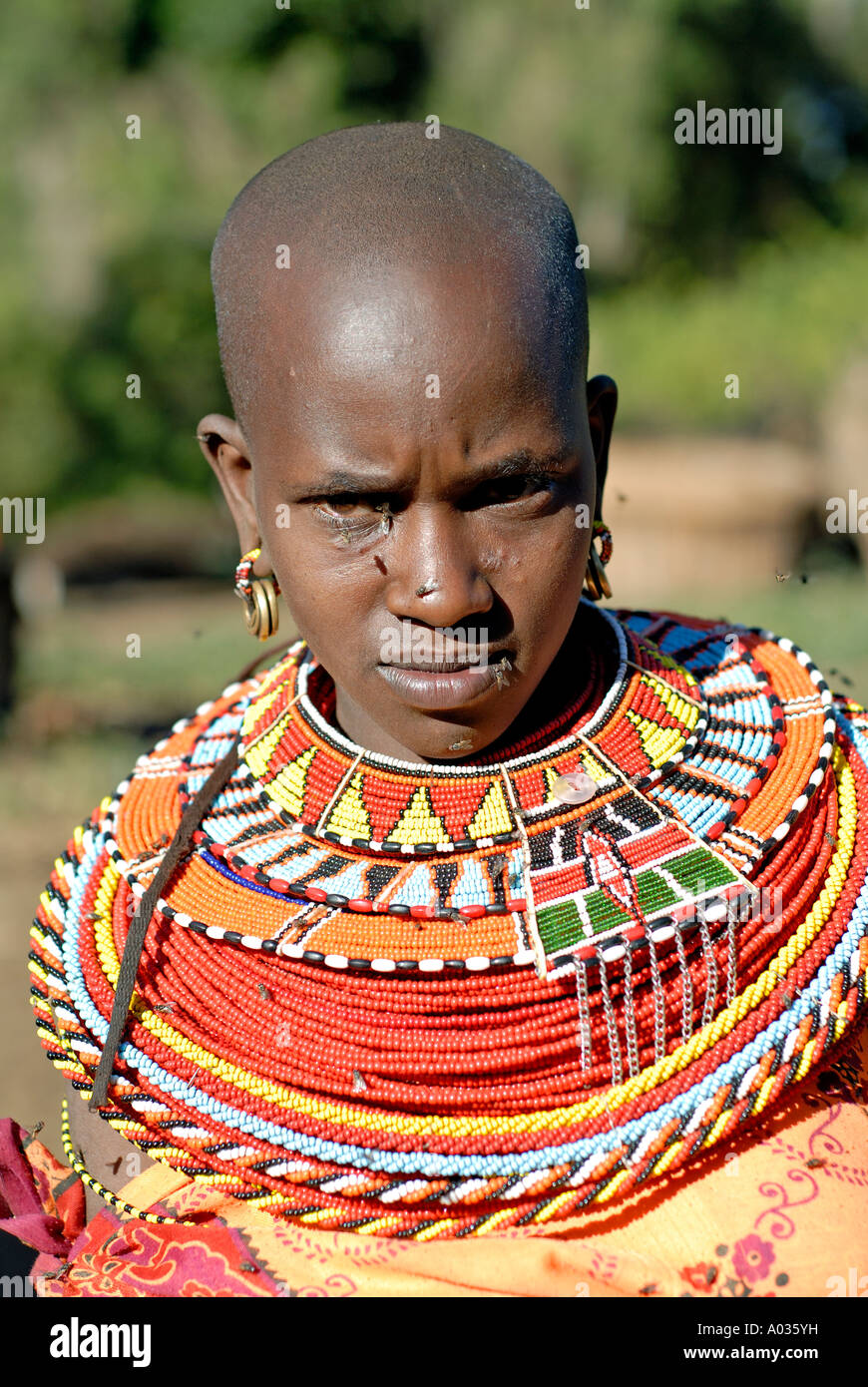 Flies on the face of Samburu woman in a village of the Nyiru 