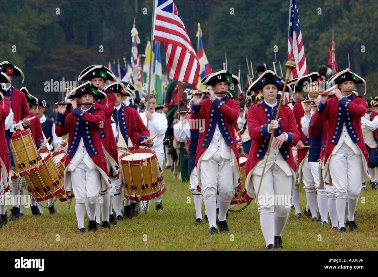 British fife and drum corps reenactors with American regiment following at the surrender at Yorktown Virginia. Digital photograph Stock Photo