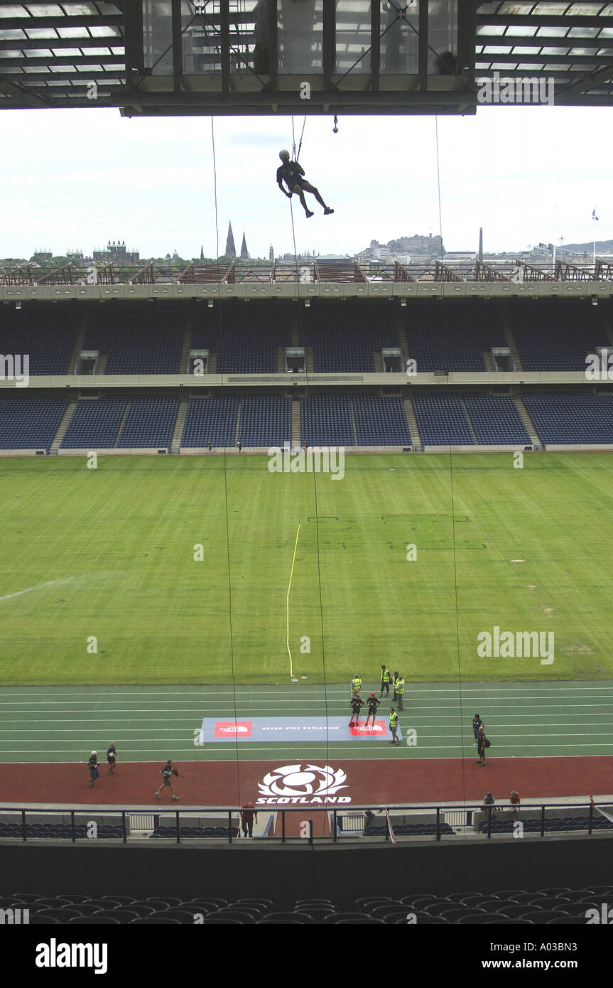 Competitors abseiling from the top of Murrayfield Stadium, during ...