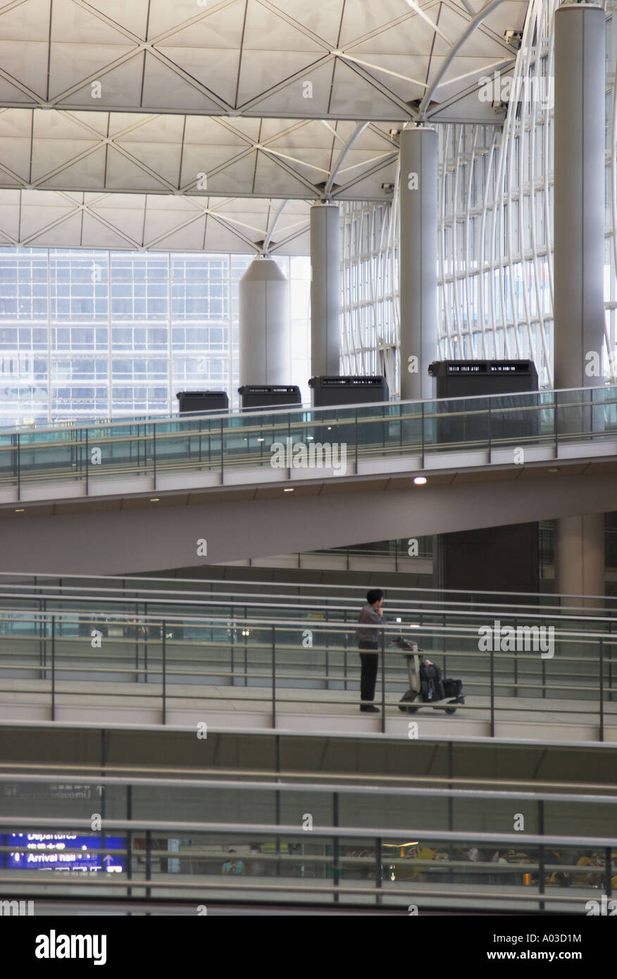 Passenger Walking Along Ramp At Hong Kong International Airport Stock Photo