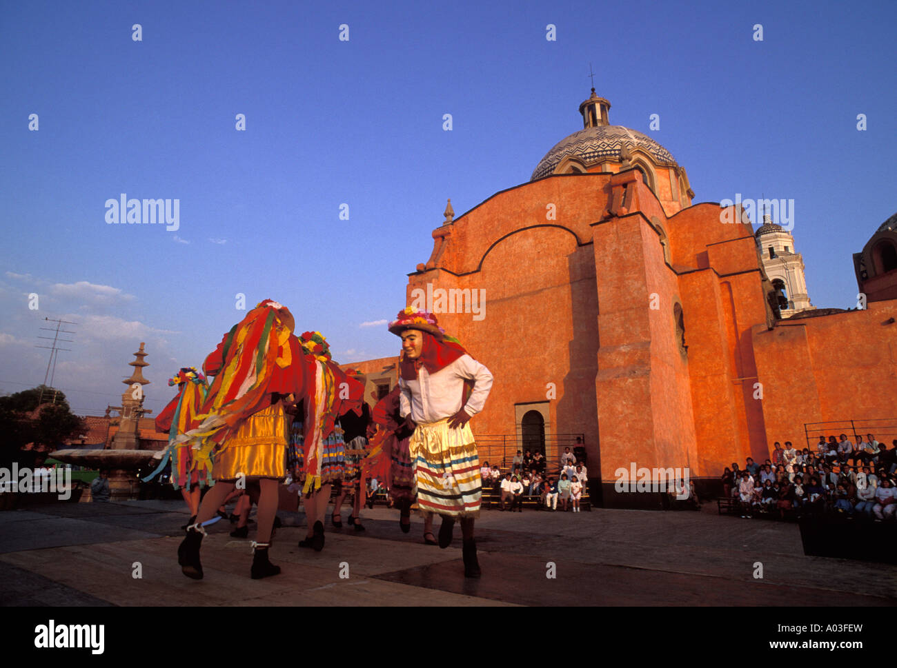 Stock image of carnival dancers in masks and costume in Tlaxcala Mexico