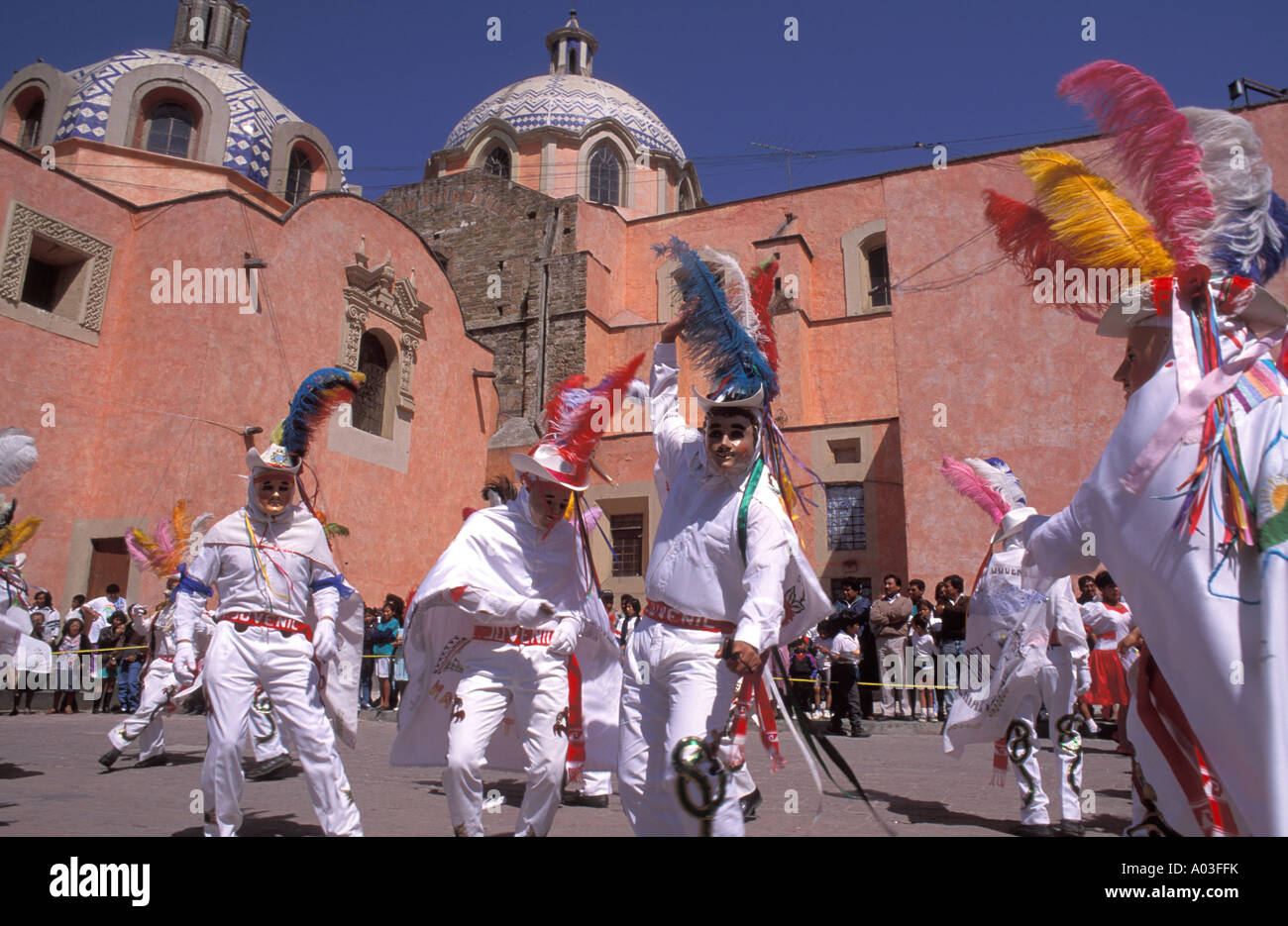 Stock image of carnival dancers in masks and costume in Tlaxcala Mexico